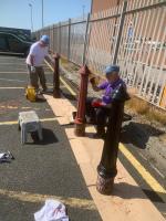 Rotarians Tony Tait [Whitehaven Castle] and Ronnie Proudfoot [Whitehaven] renovating bollards which will be placed in the main promenade.